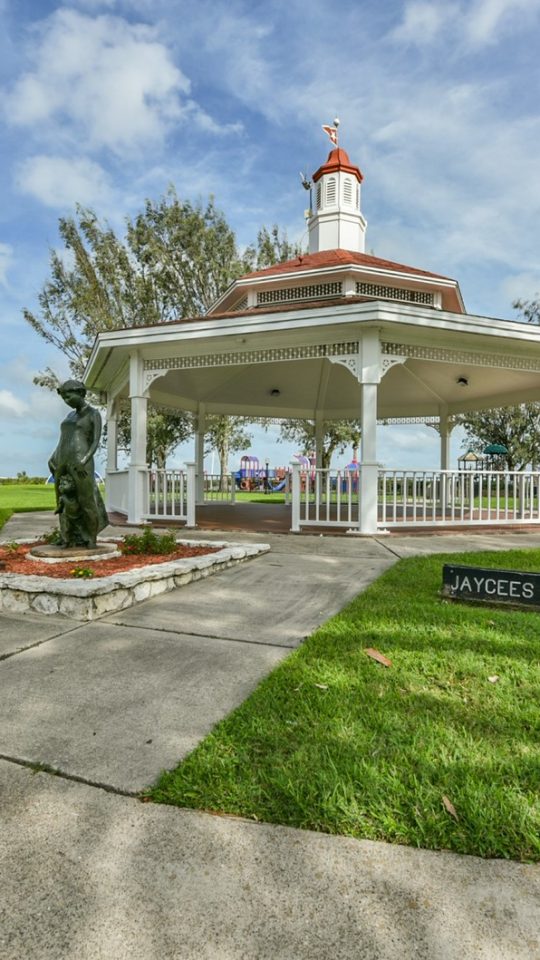 a gazebo sits in the middle of a park at The Shoal Pointe Apartments